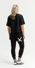 Load image into Gallery viewer, Alpine Apartment pant black w silver X and striped cuff
