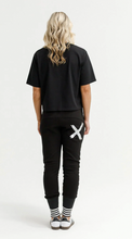 Load image into Gallery viewer, Alpine Apartment pant black w silver X and striped cuff
